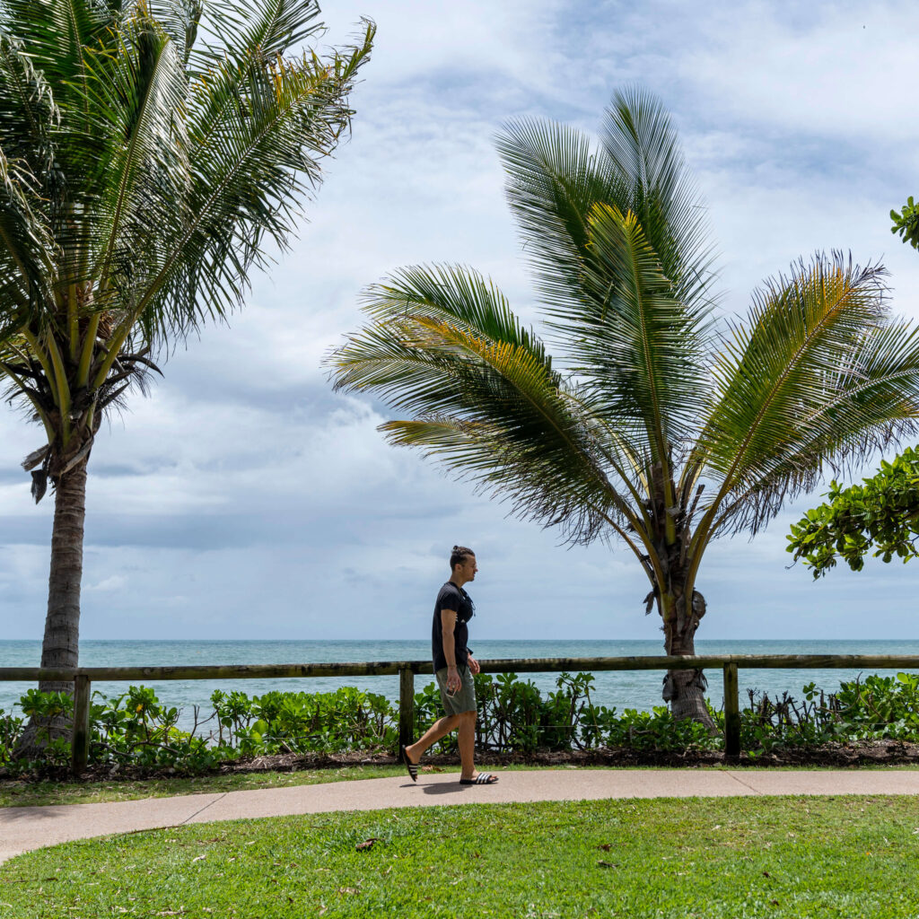 Man walking next to beach in Cairns